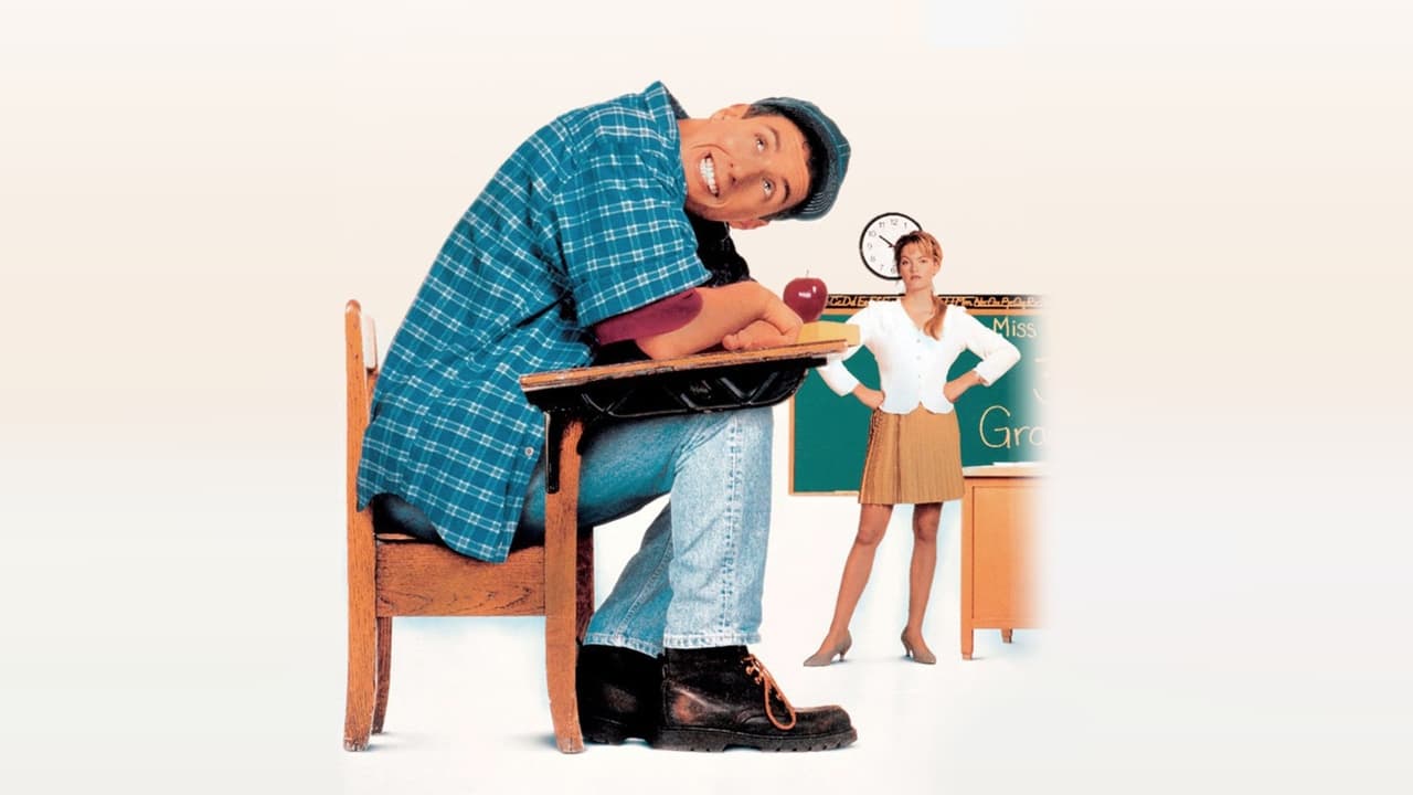 Adam Sandler as Billy Madison seated at a school desk